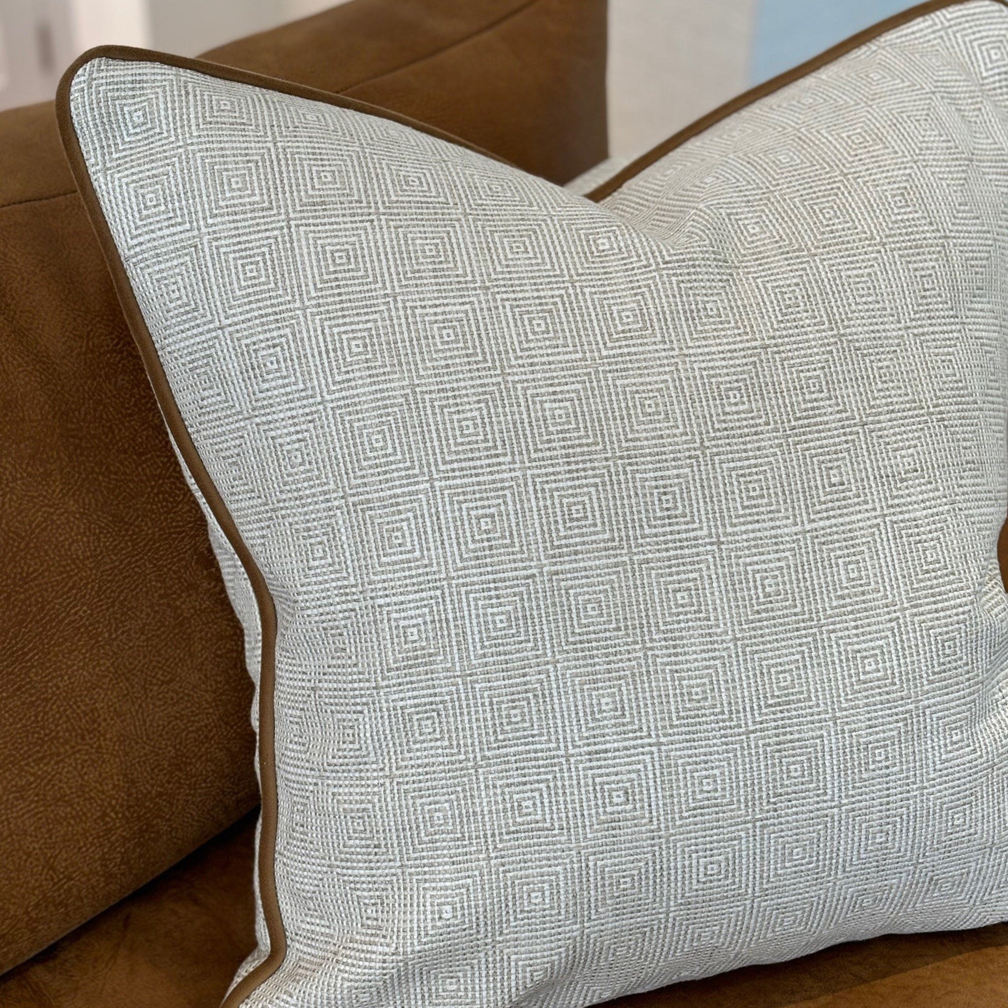 Ecru Geometric Patterned Cushion with Tan Piping